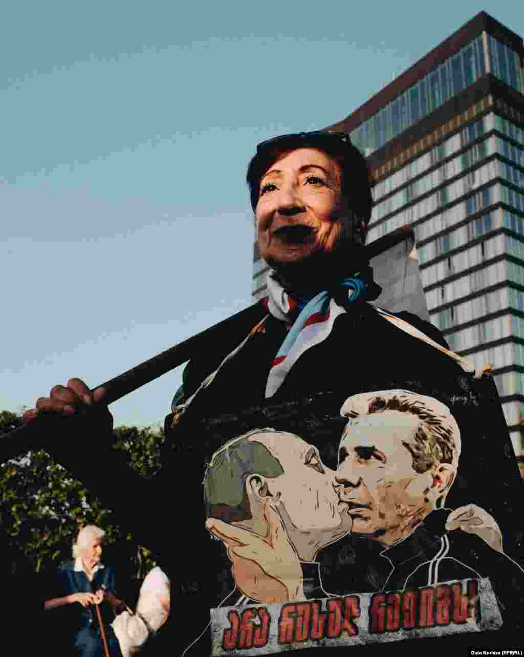A woman attends the protest earlier in the day on April 28.&nbsp; Supporters of the bill say it mirrors similar U.S. legislation and promotes transparency. Opponents say the proposed legislation would stifle dissent and silence independent media. They have compared it to similar legislation in Russia, which is why many call it the &quot;Russian law.&quot;&nbsp;