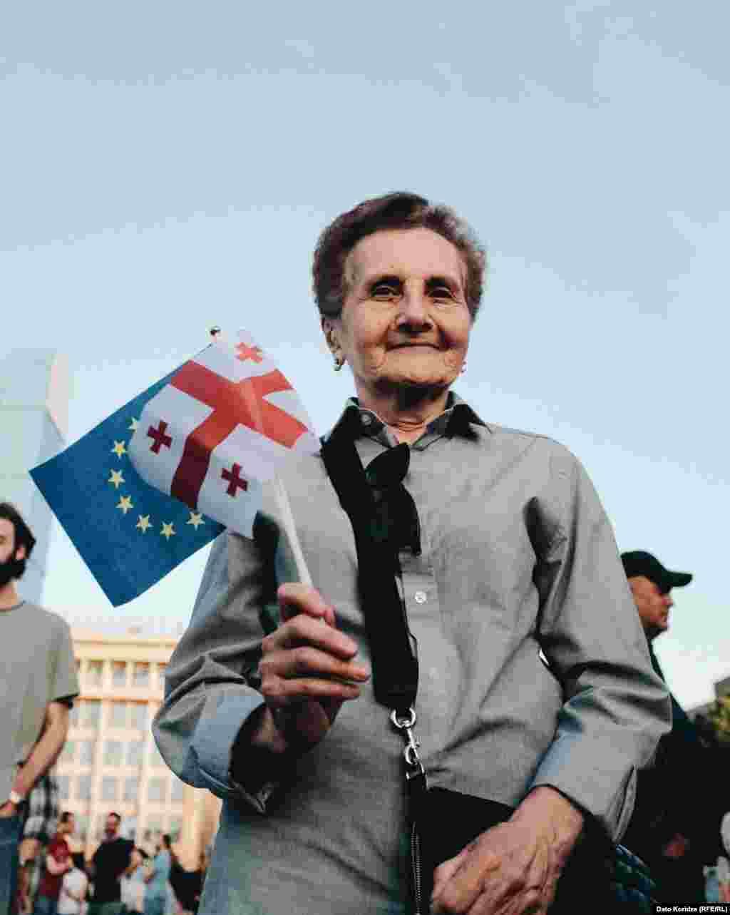 Another protester carries both a Georgian and an EU flag near the parliament building. The final reading of the bill is scheduled to be debated on May 17. Georgian President Salome Zurabishvili told media that she will veto it if it&rsquo;s approved in its final reading.&nbsp;However, she also said the ruling Georgian Dream party has enough lawmakers to override her decision if she does so.