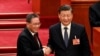 Președintele Xi Jinping (în dreapta) și noul premier, Li Qiang, în timpul unei sesiuni a Parlamentului chinez, de la Palatul Poporului din Beijing.