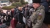 Civili evacuați din Herson la gara Djankoi din Crimeea, 21 octombrie 2022. Autoritățile instalate de ruși la Herson au spus pe 20 octombrie că aproximativ 15.000 oameni au fost scoși din teritoriul pe care Rusia l-a anexat în fața înaintării armatei ucrainene.