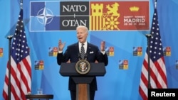 U.S. President Joe Biden talks to reporters in Madrid on June 30. 