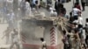Demonstrators in Kabul destroy a police check post on May 29