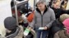 Немцов раздает листовки оппозиционного марша "Весна" 
