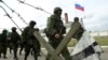 Вооруженные люди без опознавательных знаков в селе Перевальное близ Симферополя. 4 марта 2014 года.