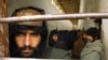 Taliban fighters in custody in northern Afghanistan in January 2002