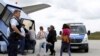 Germany -- Albanian and Kosovo refugees board an airplane to Tirana and Prishtina, at Munich airport, July 14, 2015