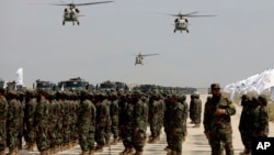 US-made Black Hawk helicopters fly during a military parade in August 2024 at Bagram to mark the third anniversary of the withdrawal of US-led troops from Afghanistan.