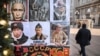 RUSSIA – A man walks past t-shirts with images of Russian President Vladimir Putin at a gift shop in downtown Moscow on February 16, 2022 