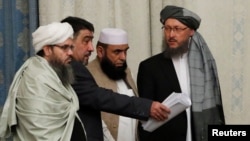 Members of Taliban delegation take their seats during the multilateral peace talks on Afghanistan in Moscow, Russia November 9, 2018. REUTERS/Sergei Karpukhin