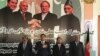 Officials from Turkmenistan, Afghanistan, Pakistan, and India meet at a TAPI project meeting in Herat, Afghanistan, in April, posing in front of a poster of the leaders of their countries.