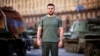 Ukrainian President Volodymyr Zelenskiy stands amid a display of damaged Russian armored vehicles in Kyiv on August 24, a date that marks 31 years since Ukraine's independence and six months since Russia began its invasion.