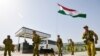 Tajik troops stand guard at the Somon border outpost on the border with Afghanistan, which also borders Uzbekistan and Turkmenistan. 