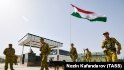 Tajik troops stand guard at the Somon border outpost on the border with Afghanistan, which also borders Uzbekistan and Turkmenistan. 