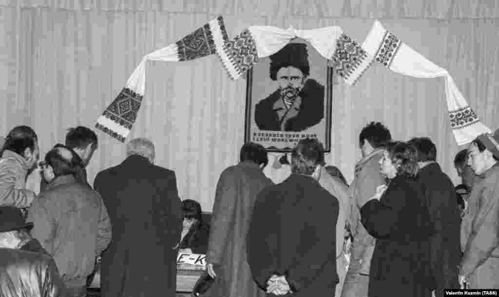 Under the watchful gaze of Taras Shevchenko, voters cast their ballots. Shevchenko's literary legacy is widely regarded as the bedrock of modern Ukrainian literature and, to a large extent, the modern Ukrainian language. 