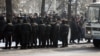 Сотрудники полиции наблюдают за участниками "митинга несогласных". Алматы, 25 февраля 2012 года.