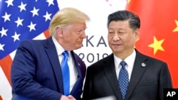 Претседателите на САД и Кина, Доналд Трамп и Си Џинпинг, во Осака, 29 јуни 2019 г.