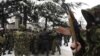 Появляются маски на лицах защитников отечества и цхинвальский анекдот по этому поводу: "Зачем вам маски, здесь вас и так никто не знает в лицо"