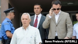 Mugošin sin (na fotografiji desno) optužen je skupa sa ocem