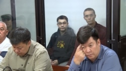 Videographers Alexander Alexandrov and Zhoomart Duulatov in the courtroom. 