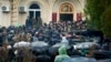Protesters besiege the offices of the de facto presidential administration on January 9.