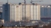 Новый 12-этажный дом «Шапагат», построенный на месте снесенного аварийного жилого комплекса «Бесоба». Караганда, 23 января 2014 год. 