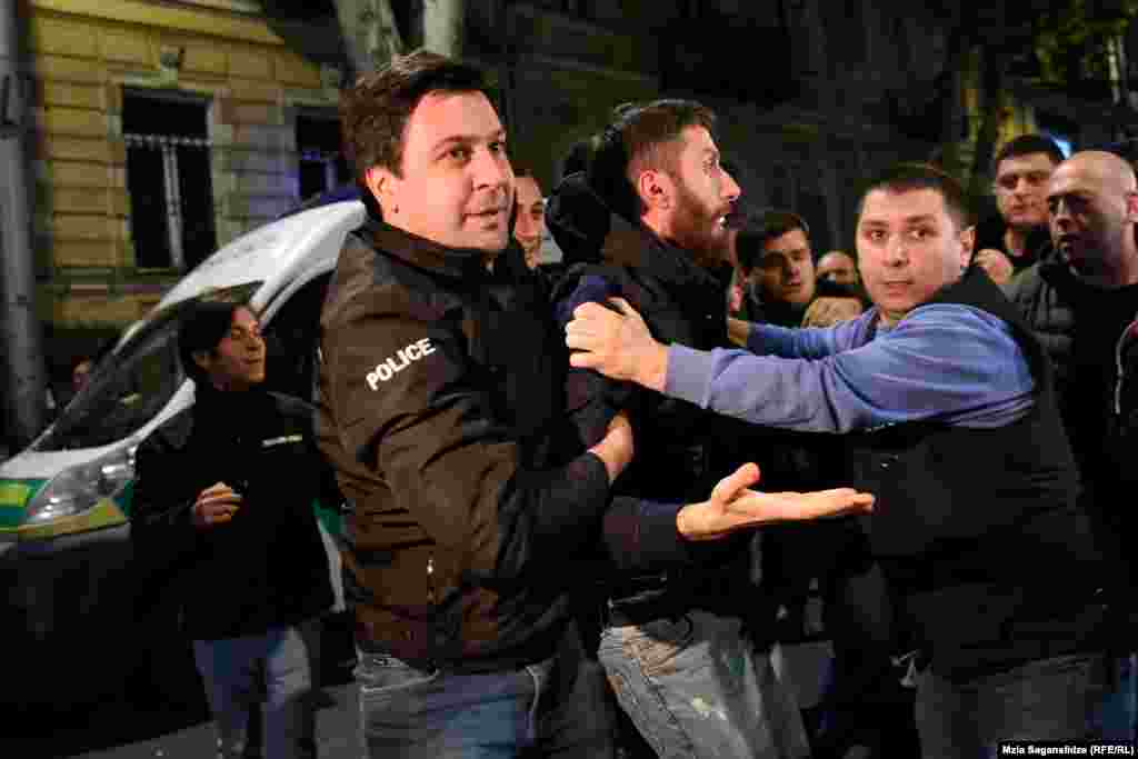 A demonstrator is arrested in Tbilisi. At least five protestors were detained on various charges. 