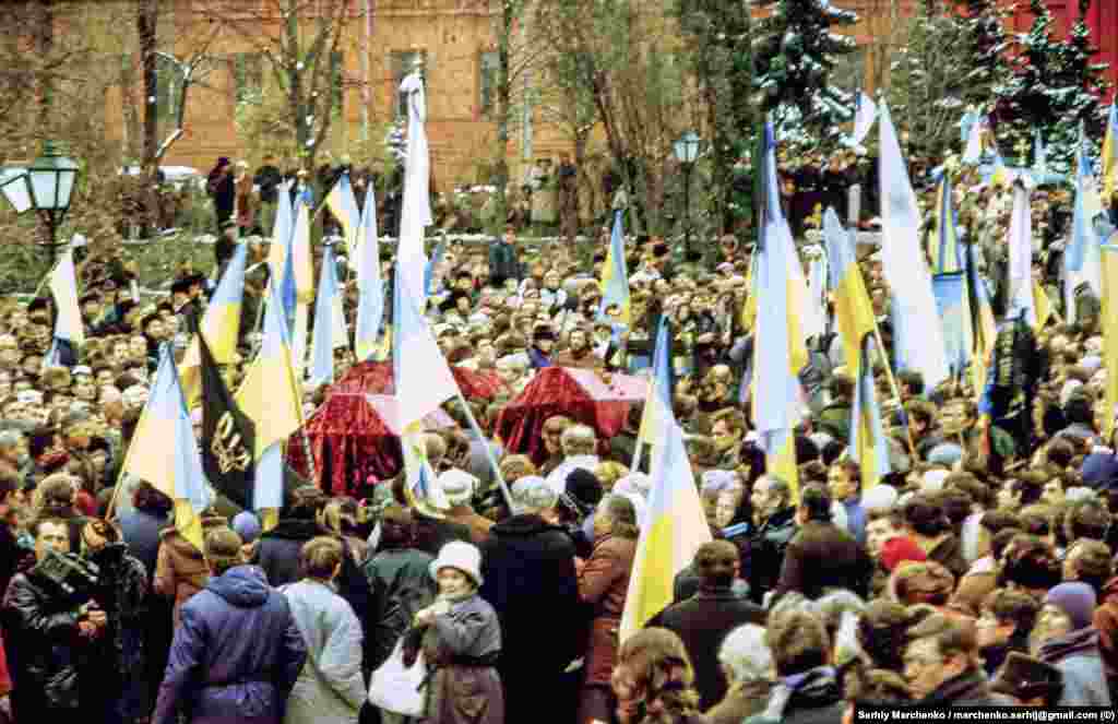 Dissidents paid an especially heavy price, such as Vasyl Stus, Yuriy Lytvyn, and Oleksa Tykhyi, who were reburied (pictured) in Kyiv on November 19, 1989, with the then-banned Ukrainian flag proudly displayed. The three died while serving time for various crimes including "anti-Soviet activity" and "anti-Soviet agitation and propaganda." 